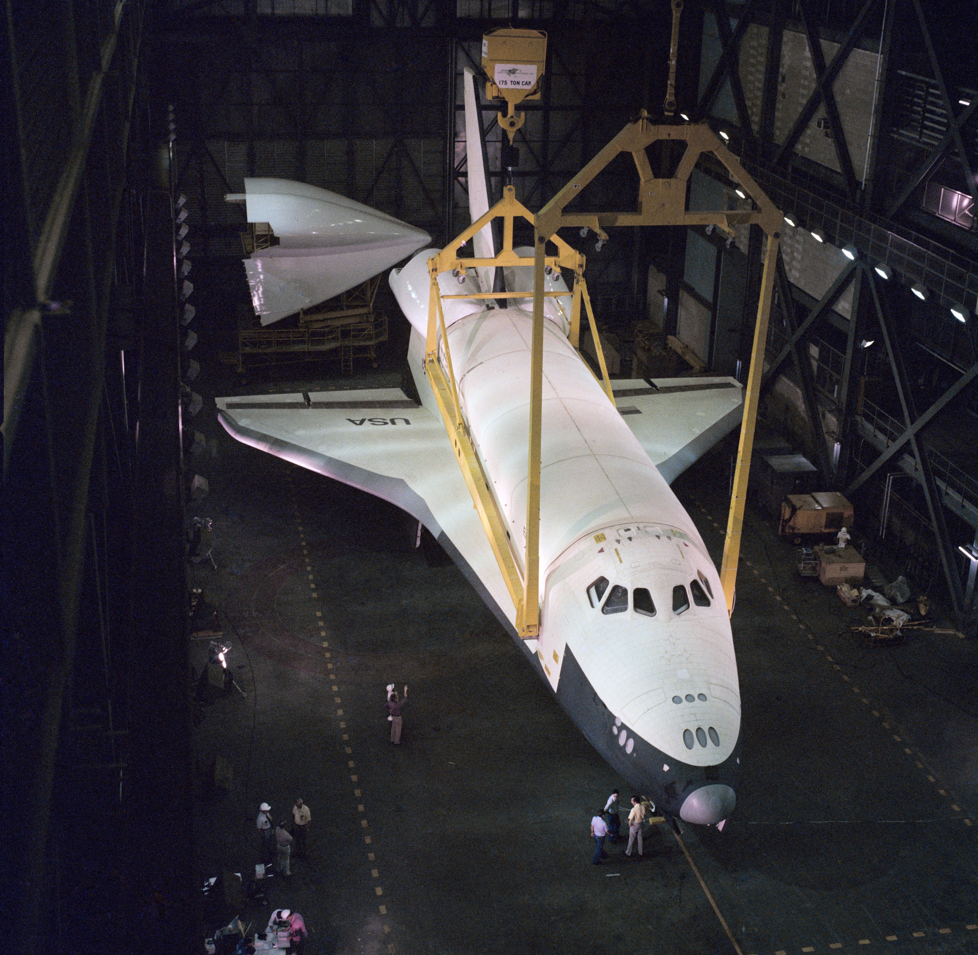 At NASA's Kennedy Space Center in Florida, workers in the Vehicle Assembly Building prepare to lift Enterprise