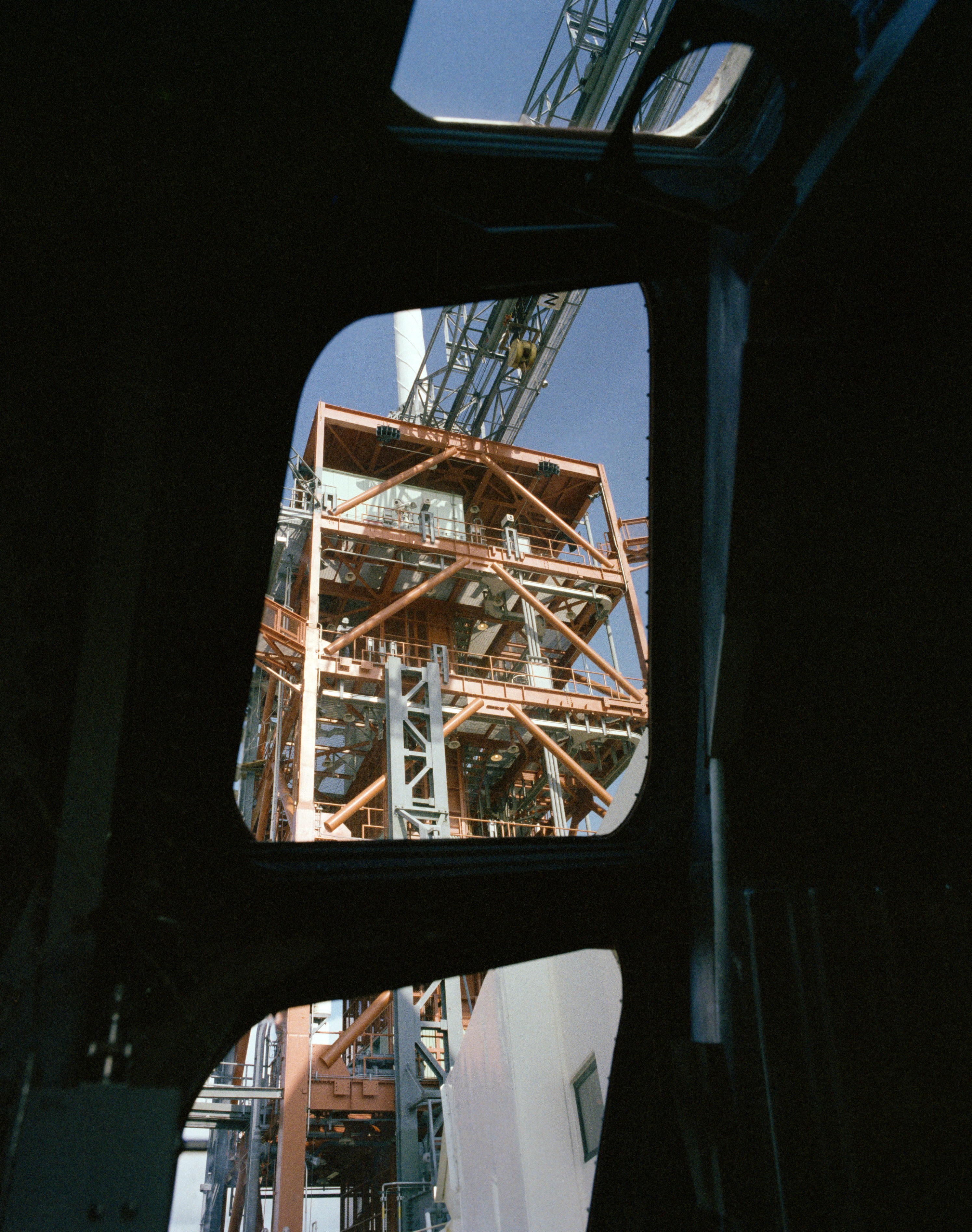 Pilot’s eye view of the launch tower looking up through Enterprise’s forward windows