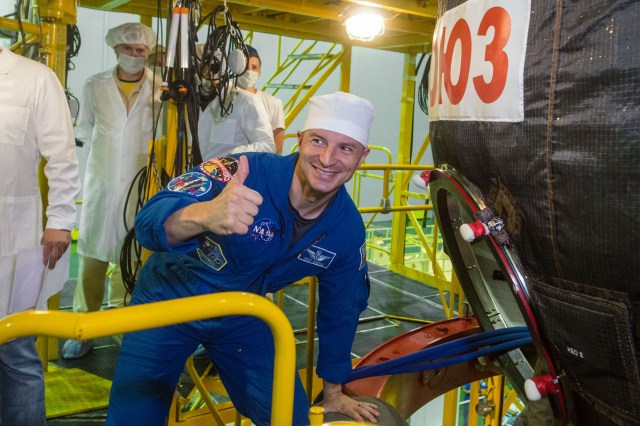 jsc2019e038385 (July 5, 2019) --- At the Baikonur Cosmodrome in Kazakhstan, Expedition 60 crewmember Drew Morgan of NASA flashes a thumbs up as he boards his Soyuz spacecraft July 5 for pre-launch preparations. Morgan, Luca Parmitano of the European Space Agency and Alexander Skvortsov of Roscosmos will launch July 20 on the Soyuz MS-13 spacecraft from the Baikonur Cosmodrome for a mission on the International Space Station. Credit: Andrey Shelepin/GCTC