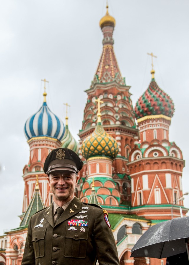 jsc2019e036815 (June 28, 2019) --- With St. Basil’s Cathedral in Moscow’s Red Square providing the backdrop, Expedition 60 crewmember Drew Morgan of NASA poses for pictures June 28 as part of traditional pre-launch activities. Morgan, Luca Parmitano of the European Space Agency and Alexander Skvortsov of Roscosmos will launch July 20 on the Soyuz MS-13 spacecraft from the Baikonur Cosmodrome in Kazakhstan for a mission on the International Space Station. Credit: NASA/Beth Weissinger