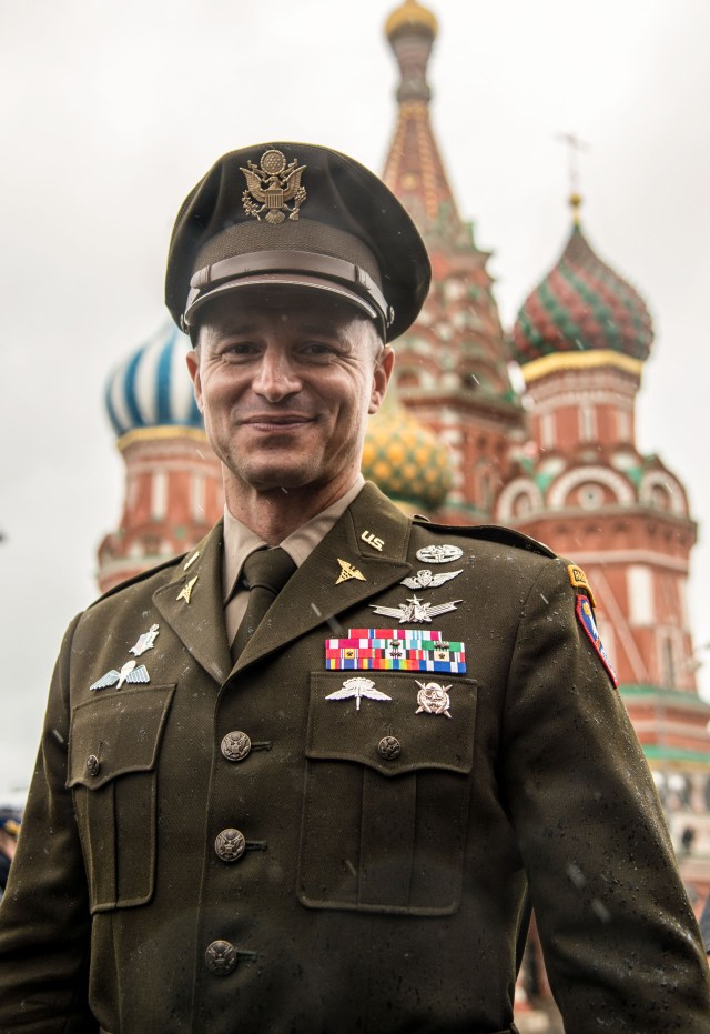 jsc2019e036814 (June 28, 2019) --- With St. Basil’s Cathedral in Moscow’s Red Square providing the backdrop, Expedition 60 crewmember Drew Morgan of NASA poses for pictures June 28 as part of traditional pre-launch activities. Morgan, Luca Parmitano of the European Space Agency and Alexander Skvortsov of Roscosmos will launch July 20 on the Soyuz MS-13 spacecraft from the Baikonur Cosmodrome in Kazakhstan for a mission on the International Space Station. Credit: NASA/Beth Weissinger
