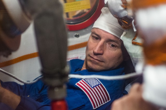 jsc2019e038387 (July 5, 2019) --- At the Baikonur Cosmodrome in Kazakhstan, Expedition 60 crewmember Drew Morgan of NASA runs through procedures aboard his Soyuz spacecraft July 5 as part of pre-launch preparations. Morgan, Luca Parmitano of the European Space Agency and Alexander Skvortsov of Roscosmos will launch July 20 on the Soyuz MS-13 spacecraft from the Baikonur Cosmodrome for a mission on the International Space Station. Credit: Andrey Shelepin/GCTC