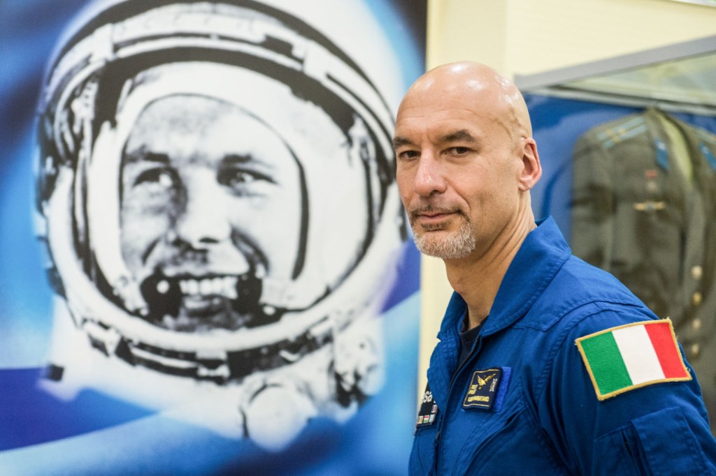 jsc2019e039426 (July 16, 2019) --- At the Baikonur Cosmodrome in Kazakhstan, Expedition 60 crewmember Luca Parmitano of the European Space Agency poses for pictures July 16 next to a wall mural of Yuri Gagarin, the first human to fly in space. Parmitano, Drew Morgan of NASA and Alexander Skvortsov of Roscosmos will launch July 20 on the Soyuz MS-13 spacecraft from the Baikonur Cosmodrome for a mission on the International Space Station. Credit: Andrey Shelepin/GCTC