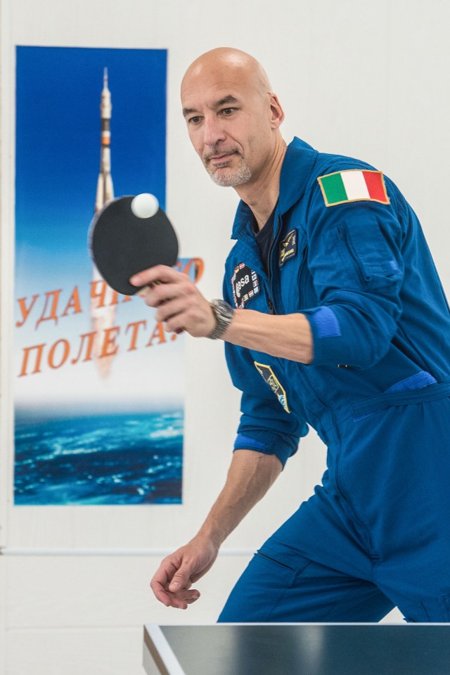 jsc2019e039271 (July 12, 2019) --- At the Cosmonaut Hotel crew quarters in Baikonur, Kazakhstan, Expedition 60 crewmember Luca Parmitano of the European Space Agency tries his hand at a game of ping-pong July 12 as part of pre-launch activities. Parmitano, Drew Morgan of NASA and Alexander Skvortsov of Roscosmos will launch July 20 on the Soyuz MS-13 spacecraft from the Baikonur Cosmodrome in Kazakhstan on a mission to the International Space Station. Credit: Andrey Shelepin/GCTC