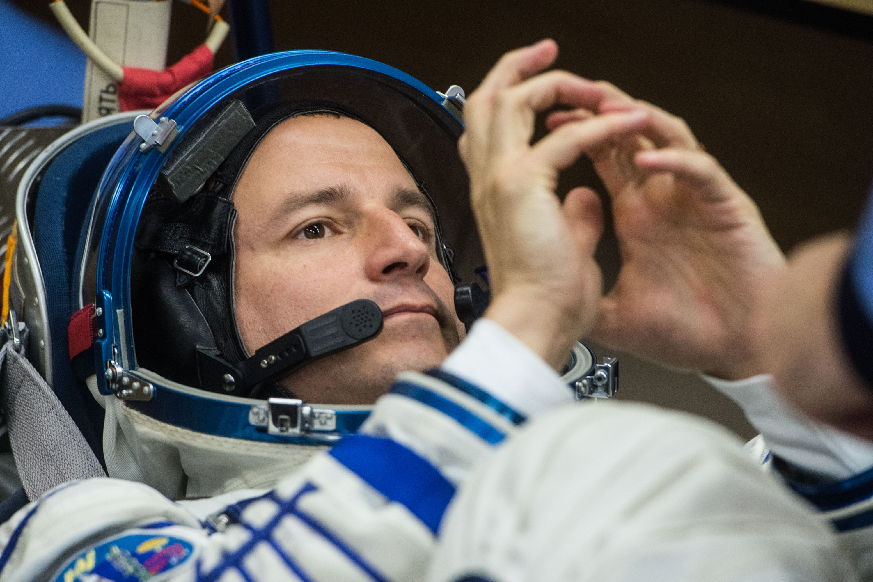 jsc2019e038378 (July 5, 2019) --- At the Baikonur Cosmodrome in Kazakhstan, Expedition 60 crewmember Drew Morgan of NASA undergoes a Sokol launch and entry suit leak check July 5 as part of pre-launch preparations. Morgan, Luca Parmitano of the European Space Agency and Alexander Skvortsov of Roscosmos will launch July 20 on the Soyuz MS-13 spacecraft from the Baikonur Cosmodrome for a mission on the International Space Station. Credit: Andrey Shelepin/GCTC