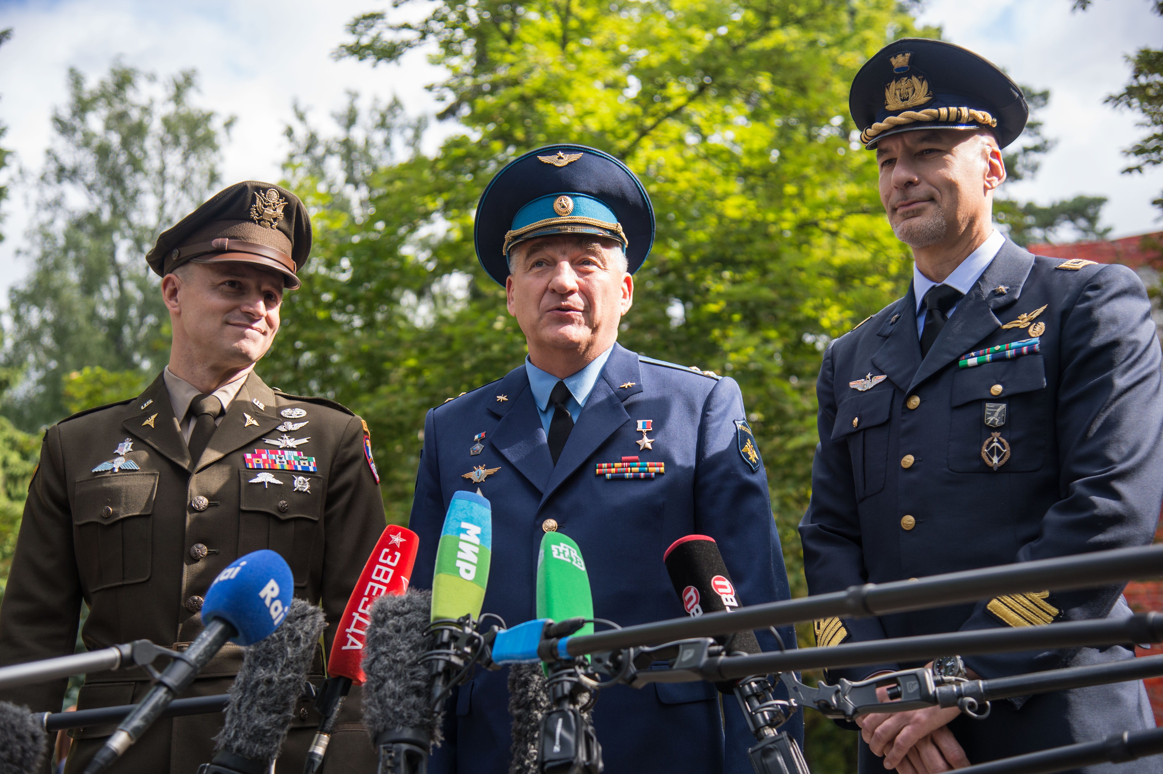 jsc2019e038374 (July 4, 2019) --- At the Gagarin Cosmonaut Training Center in Star City, Russia, Expedition 60 crewmembers Drew Morgan of NASA (left), Alexander Skvortsov of Roscosmos (center) and Luca Parmitano of the European Space Agency (right) answer reporters’ questions July 4 before departing for their launch site in Kazakhstan. They will launch July 20 from the Baikonur Cosmodrome in Kazakhstan on the Soyuz MS-13 spacecraft for a mission on the International Space Station. Credit: NASA/Beth Weissinger