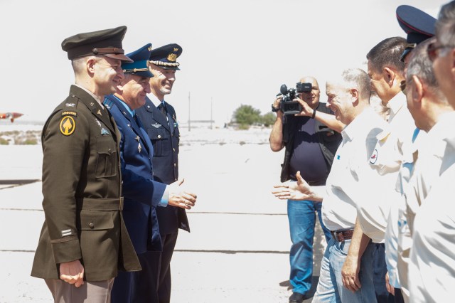 At the Baikonur Cosmodrome in Kazakhstan, Expedition 60 crewmembers Drew Morgan of NASA (left), Alexander Skvortsov of Roscosmos (center) and Luca Parmitano of the European Space Agency (right) are greeted by Russian space officials July 4 for final pre-launch preparations after a flight from their training base outside Moscow. They will launch July 20 from the Baikonur Cosmodrome in Kazakhstan on the Soyuz MS-13 spacecraft for a mission on the International Space Station. Andrey Shelepin/GCTC