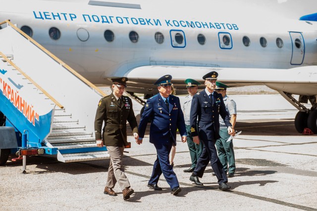 jsc2019e038368 (July 4, 2019) --- At the Baikonur Cosmodrome in Kazakhstan, Expedition 60 crewmembers Drew Morgan of NASA (left), Alexander Skvortsov of Roscosmos (center) and Luca Parmitano of the European Space Agency (right) arrive July 4 for final pre-launch preparations after a flight from their training base outside Moscow. They will launch July 20 from the Baikonur Cosmodrome in Kazakhstan on the Soyuz MS-13 spacecraft for a mission on the International Space Station. Credit: Andrey Shelepin/GCTC