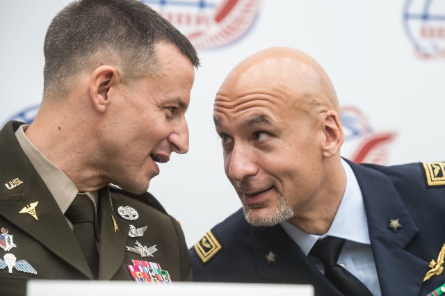 jsc2019e036810 (June 28, 2019) --- At the Gagarin Cosmonaut Training Center in Star City, Russia, Expedition 60 crewmembers Drew Morgan of NASA (left) and Luca Parmitano of the European Space Agency (right) share a moment during a crew news conference June 28. They will launch along with Alexander Skvortsov of Roscosmos July 20 on the Soyuz MS-13 spacecraft from the Baikonur Cosmodrome in Kazakhstan for a mission on the International Space Station. Credit: Andrey Shelepin/GCTC