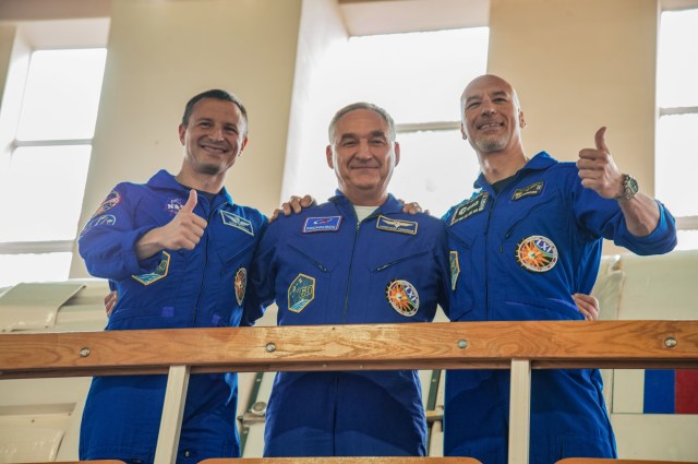 jsc2019e035261 (June 26, 2019) --- At the Gagarin Cosmonaut Training Center in Star City, Russia, Expedition 60 crewmembers Drew Morgan of NASA (left), Alexander Skvortsov of Roscosmos (center) and Luca Parmitano of the European Space Agency (right) pose for pictures June 26 during final qualification exams. They will launch July 20 on the Soyuz MS-13 spacecraft from the Baikonur Cosmodrome in Kazakhstan for a mission on the International Space Station. Credit: NASA/Beth Weissinger