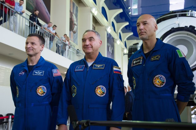 jsc2019e035258 (June 26, 2019) --- At the Gagarin Cosmonaut Training Center in Star City, Russia, Expedition 60 crewmembers Drew Morgan of NASA (left), Alexander Skvortsov of Roscosmos (center) and Luca Parmitano of the European Space Agency (right) pose for pictures June 26 during final qualification exams. They will launch July 20 on the Soyuz MS-13 spacecraft from the Baikonur Cosmodrome in Kazakhstan for a mission on the International Space Station. Credit: NASA/Beth Weissinger