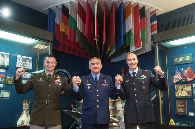 jsc2019e036808 (June 28, 2019) --- At the Gagarin Museum at the Gagarin Cosmonaut Training Center in Star City, Russia, Expedition 60 crewmembers Drew Morgan of NASA (left), Alexander Skvortsov of Roscosmos (center) and Luca Parmitano of the European Space Agency (right) pose for pictures June 28 during pre-launch activities. They will launch July 20 on the Soyuz MS-13 spacecraft from the Baikonur Cosmodrome in Kazakhstan for a mission on the International Space Station. Credit: Andrey Shelepin/GCTC