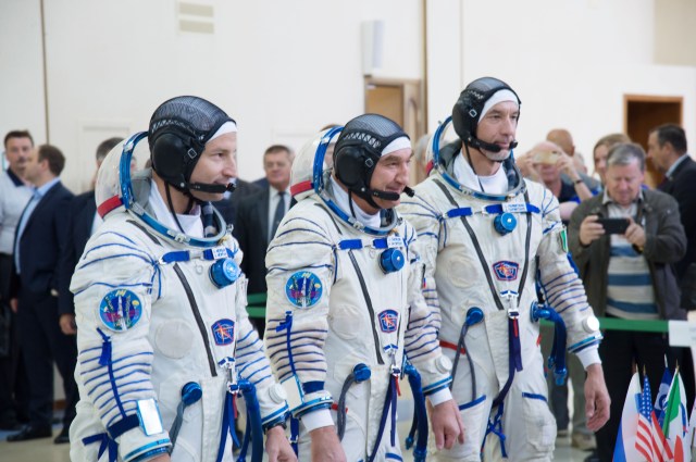 jsc2019e035395 (June 27, 2019) --- At the Gagarin Cosmonaut Training Center in Star City, Russia, Expedition 60 crewmembers Drew Morgan of NASA (left), Alexander Skvortsov of Roscosmos (center) and Luca Parmitano of the European Space Agency (right) report to officials June 27 for the final day of crew qualification exams. They will launch on July 20 from the Baikonur Cosmodrome in Kazakhstan on the Soyuz MS-13 spacecraft for a mission to the International Space Station...NASA/Beth Weissinger