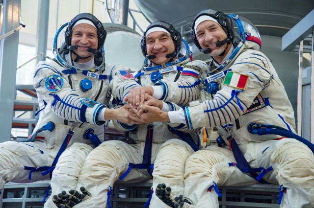 jsc2019e035391 (June 27, 2019) --- At the Gagarin Cosmonaut Training Center in Star City, Russia, Expedition 60 crewmembers (from left) Drew Morgan of NASA, Alexander Skvortsov of Roscosmos and Luca Parmitano of the European Space Agency pose for pictures June 27 during the final day of their qualification exams. They will launch on July 20 from the Baikonur Cosmodrome in Kazakhstan on the Soyuz MS-13 spacecraft for a mission to the International Space Station...NASA/Beth Weissinger
