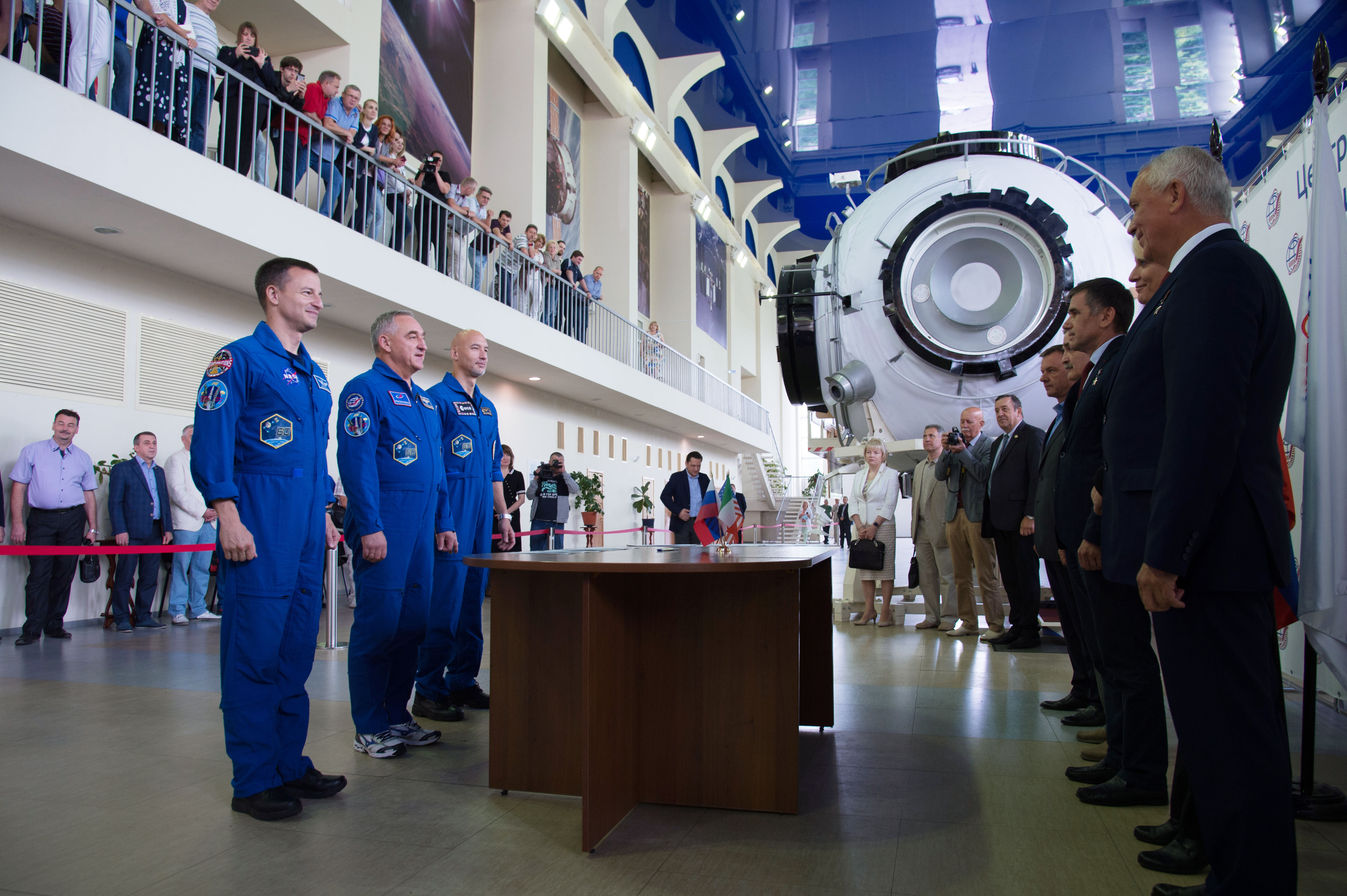 jsc2019e035254 (June 26, 2019) --- At the Gagarin Cosmonaut Training Center in Star City, Russia, Expedition 60 crewmembers Drew Morgan of NASA (left), Alexander Skvortsov of Roscosmos (center) and Luca Parmitano of the European Space Agency (right) report for their final qualification exams June 26. They will launch July 20 on the Soyuz MS-13 spacecraft from the Baikonur Cosmodrome in Kazakhstan for a mission on the International Space Station. Credit: NASA/Beth Weissinger