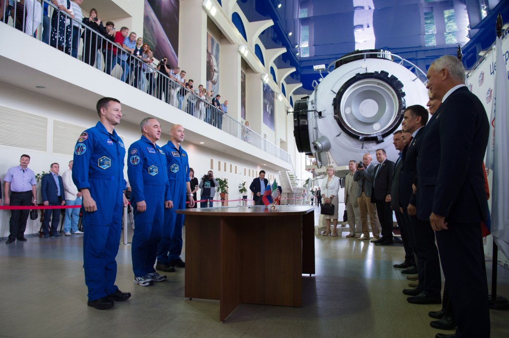 jsc2019e035254 (June 26, 2019) --- At the Gagarin Cosmonaut Training Center in Star City, Russia, Expedition 60 crewmembers Drew Morgan of NASA (left), Alexander Skvortsov of Roscosmos (center) and Luca Parmitano of the European Space Agency (right) report for their final qualification exams June 26. They will launch July 20 on the Soyuz MS-13 spacecraft from the Baikonur Cosmodrome in Kazakhstan for a mission on the International Space Station. Credit: NASA/Beth Weissinger
