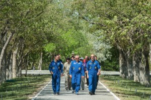jsc2019e039263 (July 12, 2019) --- At the Cosmonaut Hotel crew quarters in Baikonur, Kazakhstan, Expedition 60 crewmembers Drew Morgan of NASA (left), Alexander Skvortsov of Roscosmos (center) and Luca Parmitano of the European Space Agency (right) stroll down the Walk of the Cosmonauts July 12 as part of pre-launch activities. They will launch July 20 on the Soyuz MS-13 spacecraft from the Baikonur Cosmodrome in Kazakhstan on a mission to the International Space Station. Credit: Andrey Shelepin/GCTC