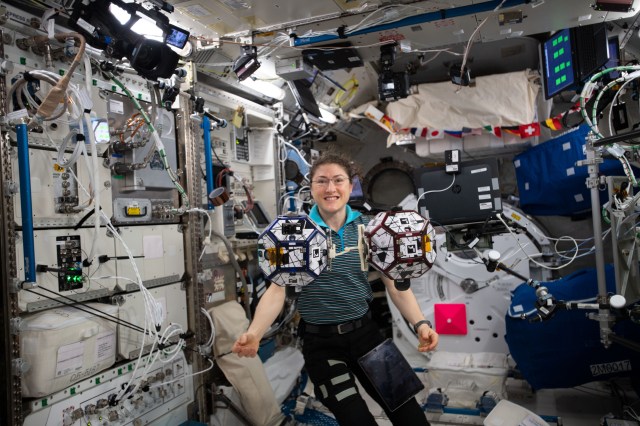 iss060e020172 (July 29, 2019) --- With advances in propulsion, swarms of small spacecraft are expected to become feasible in the near future. Expedition 60 Flight Engineer Christina Koch of NASA can be seen here floating with the SPHERES robots which are putting some of these technologies to the test. The crew was preparing to run code from participants of the SPHERES Zero Robotics (ZR) 2019 Middle School Summer Program. The SPHERES team tests algorithms developed by students and selects the best designs for the competition to operate the robots on board the space station.