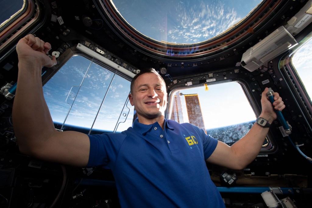 iss060e013920 (July 23, 2019) --- Expedition 60 Flight Engineer Drew Morgan of NASA is pictured inside the International Space Station's "window to the world," the seven-windowed Cupola. At the time this photograph was taken, the orbiting lab was flying 261 miles above the Caspian Sea.