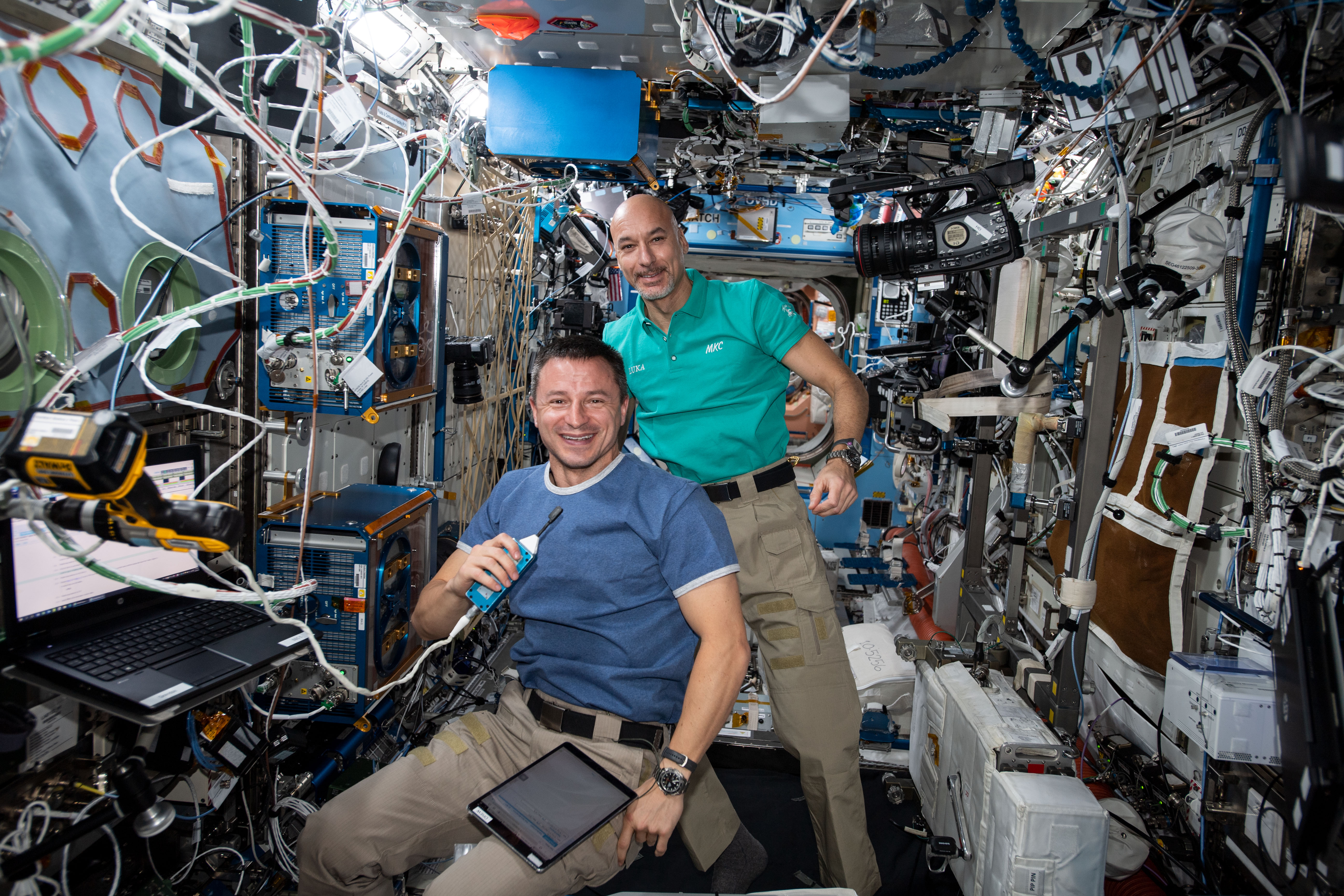 iss060e043909 (Aug. 23, 2019) --- Expedition 60 Flight Engineers Andrew Morgan of NASA and Luca Parmitano of ESA (European Space Agency) pose for a portrait while conducting maintenance activities aboard the International Space Station.