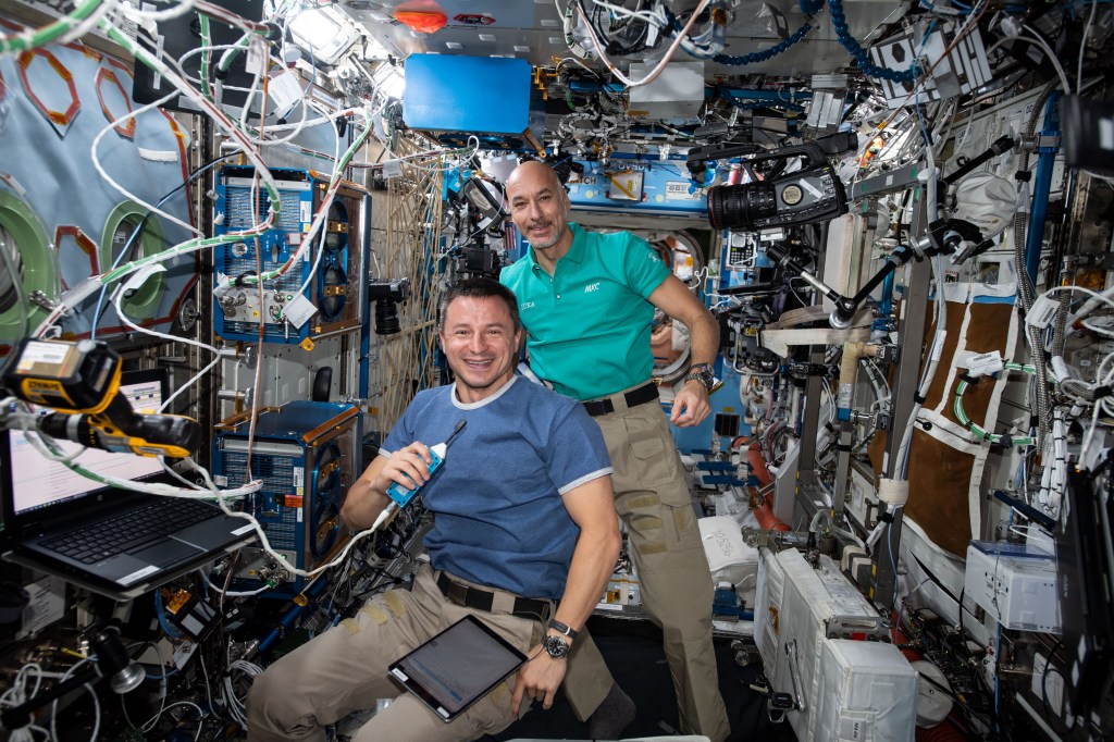iss060e043909 (Aug. 23, 2019) --- Expedition 60 Flight Engineers Andrew Morgan of NASA and Luca Parmitano of ESA (European Space Agency) pose for a portrait while conducting maintenance activities aboard the International Space Station.