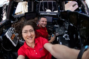 iss060e056580 (Sept. 9, 2019) --- Expedition 60 Flight Engineers Christina Koch and Andrew Morgan are inside the International Space Station's "window to the world," the seven-windowed cupola. The duo were practicing robotic capture techniques with the Canadarm2 robotic arm ahead of the arrival of the HTV-8 resupply ship from the Japan Aerospace Exploration Agency.