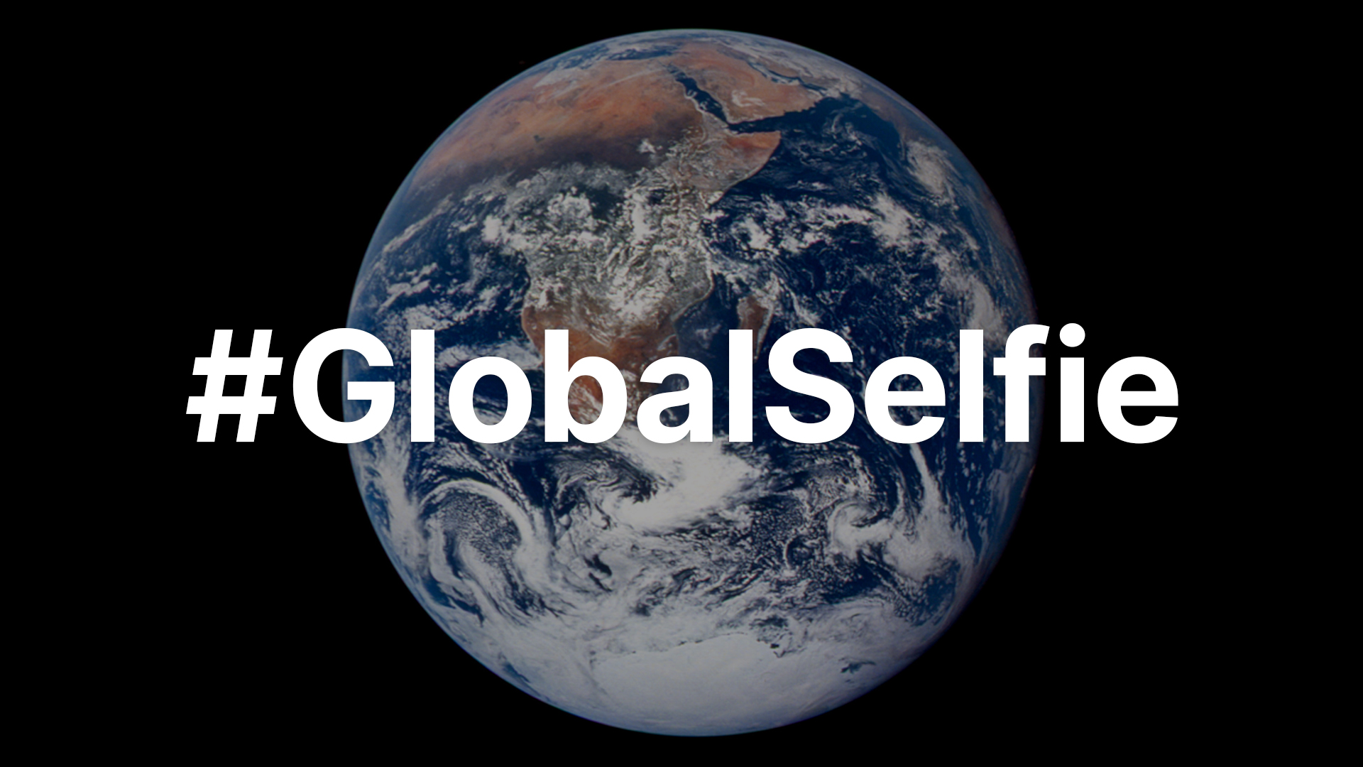 The globe of the Earth is visible against a black background. Overlaid in white lettering is "#GlobalSelfie."