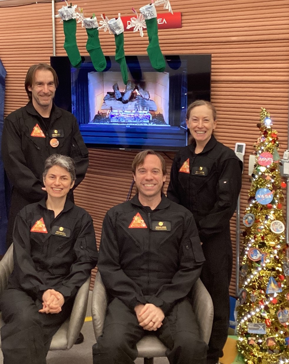 The CHAPEA mission 1 crew celebrates Christmas inside the habitat (from left: Ross Brockwell, Anca Selariu, Nathan Jones, Kelly Haston).