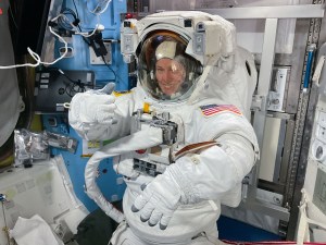 Expedition 70 Flight Engineer and NASA astronaut Loral O'Hara is pictured in her spacesuit before beginning a spacewalk for maintenance on the International Space Station's port solar alpha rotary joint, which allows the solar arrays to track the Sun and generate electricity to power the orbital outpost.
