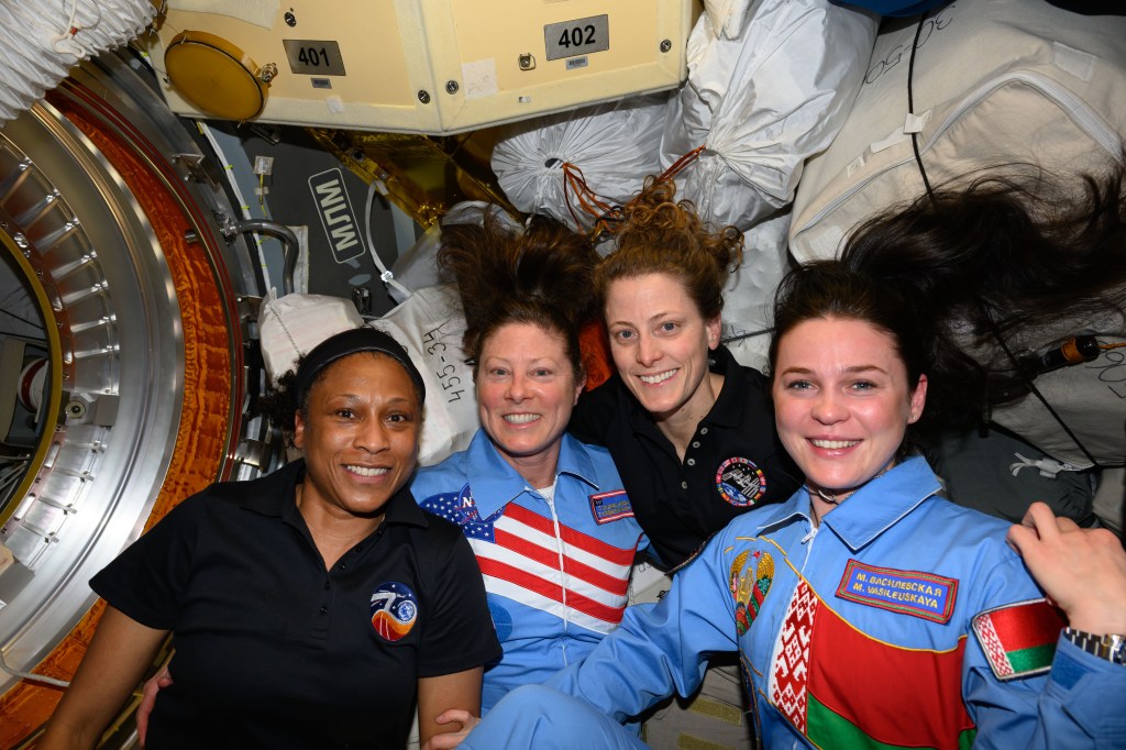 Posing for a portrait aboard the International Space Station (from left) are, NASA astronauts Jeanette Epps, Tracy C. Dyson, and Loral O'Hara, and Belarus spaceflight participant Marina Vasilevskaya. Dyson and Vasilevskaya, along with Roscosmos cosmonaut Oleg Novitskiy (out of frame), were the newest visitors to the orbital outpost after docking to the Prichal docking module aboard the Soyuz MS-25 crew ship.
