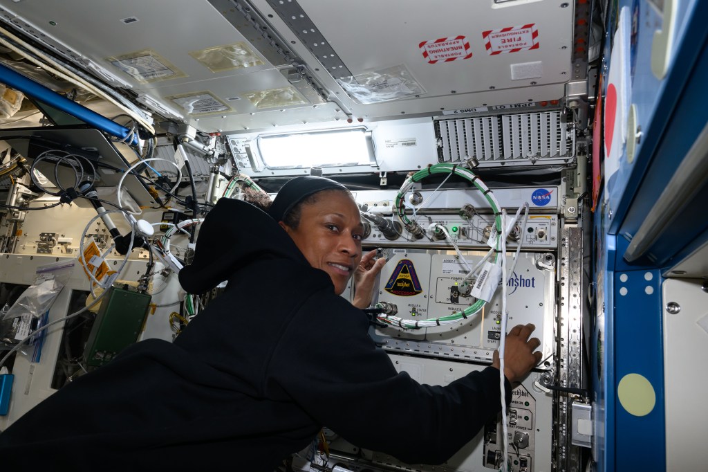 Expedition 70 Flight Engineer and NASA astronaut Jeanette Epps installs the Advanced Space Experiment Processor-2, or ADSEP-2. The scientific device can interface with the Dragon and Cygnus cargo craft and houses cassettes that process samples for biology and physics research including cell and tissue culturing, protein crystal growth, microorganism and bacteria studies, and materials science research.