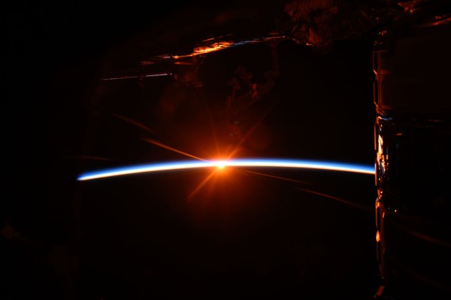 iss071e001425 (April 7, 2024) -- Orbital sunrise begins illuminating Earth's atmosphere as the Expedition 71 crew aboard the International Space Station orbited 266 miles over the Indian Ocean.