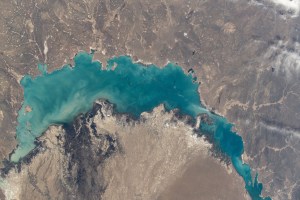 iss071e012112 (April 19, 2024) -- In southeastern Kazakhstan lies Lake Balkhash, one of the largest in Asia. Its turquoise color comes from winter ice melting. As the International Space Station soared nearly 260 miles above, NASA astronaut Mike Barratt captured this photo.