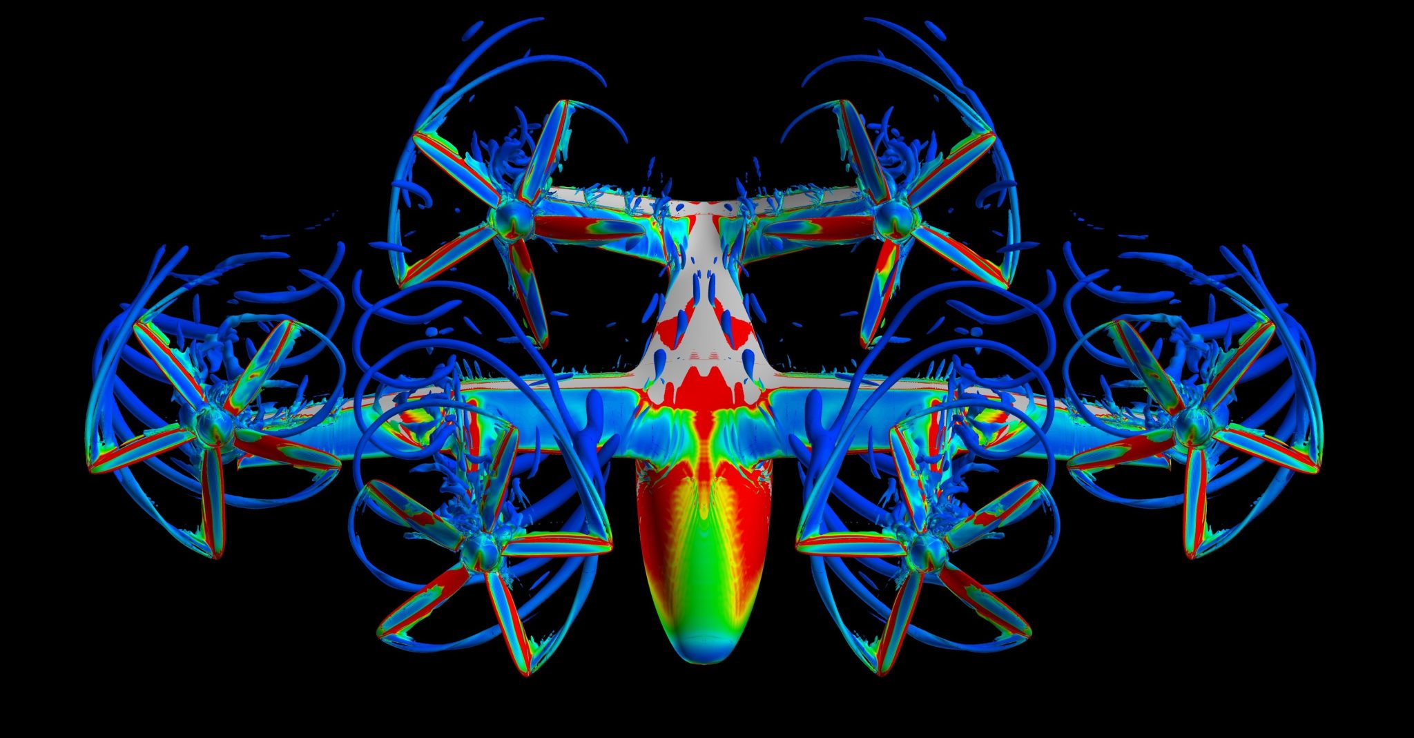 A silver aircraft model with six propellors hovers in this image and is covered in red, green, yellow, and blue colors showing the motion of air moving around the aircraft. The blue propellors show the blades are in motion.