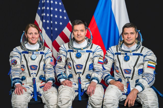 Pictured from left, Soyuz MS-24 crew members NASA astronaut Loral O'Hara and Roscosmos cosmonauts Oleg Kononenko and Nikolai Chub pose for a portrait at the Garagarin Cosmonaut Training Center in their Sokol launch and entry suits. Credit: Andrey Shelepin