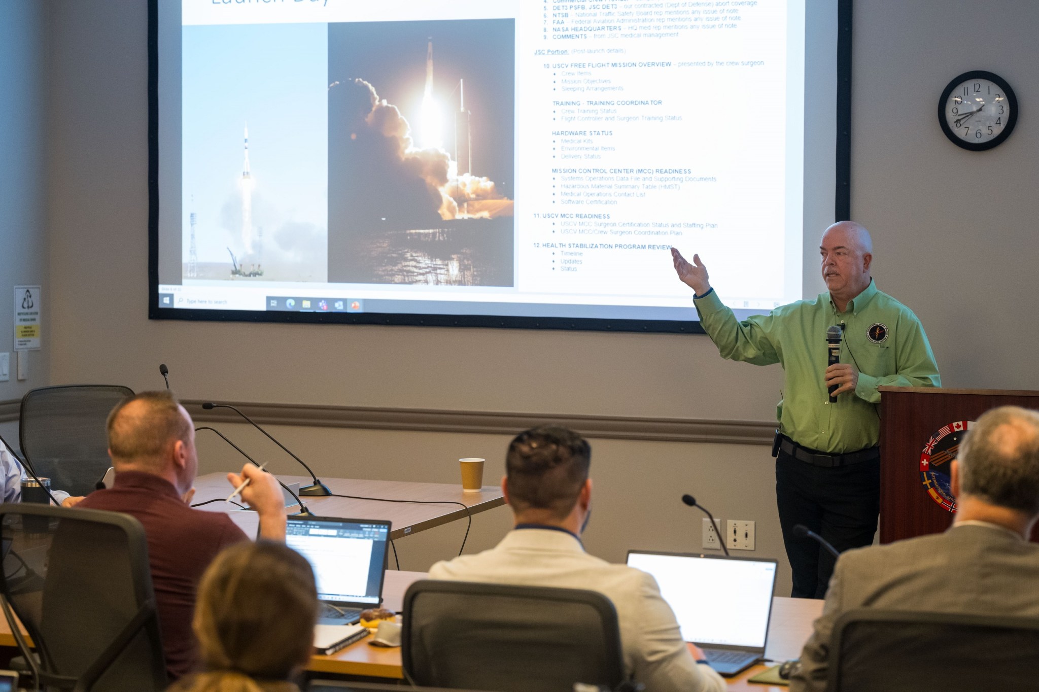 NASA flight surgeon Dr. William Tarver delivers a presentation on post-launch medical support, mission readiness, and NASA's health stabilization program.