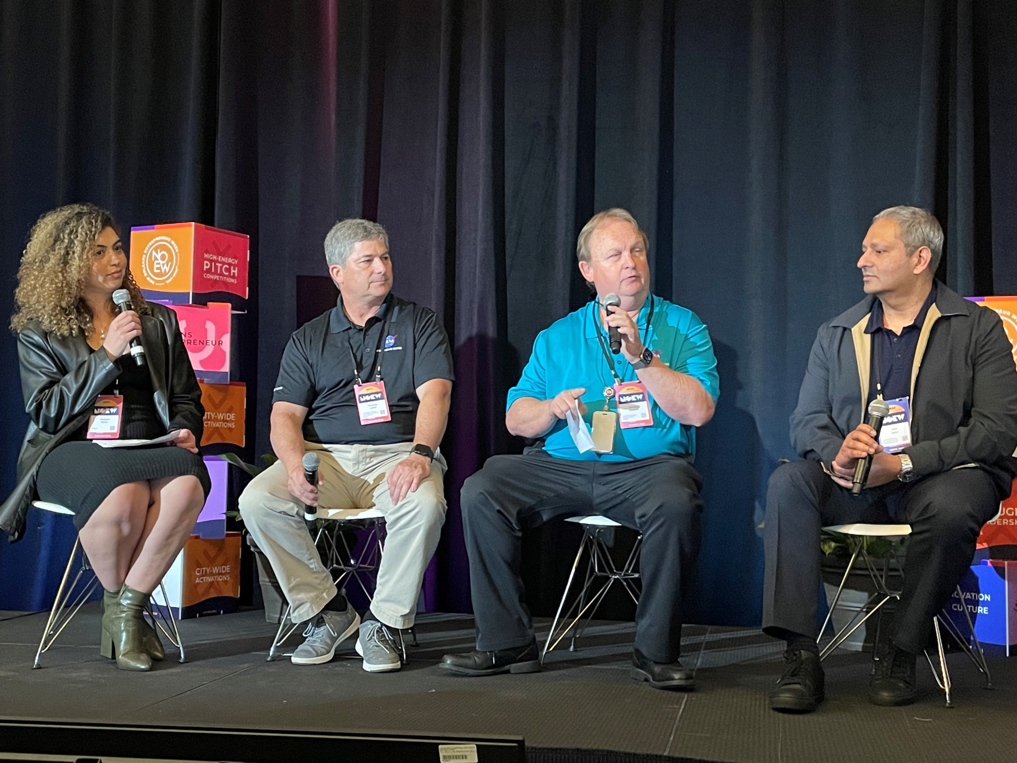 4 members of the New Orleans Entrepreneur Week panel are sitting on a stage