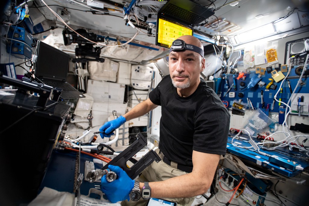 iss060e054549 -- Expedition 60 flight engineer Luca Parmitano of ESA (European Space Agency) works on swapping out a power cable located in the Fluid Science Laboratory, which is a facility designed by ESA for conducting fluid physics research in microgravity.