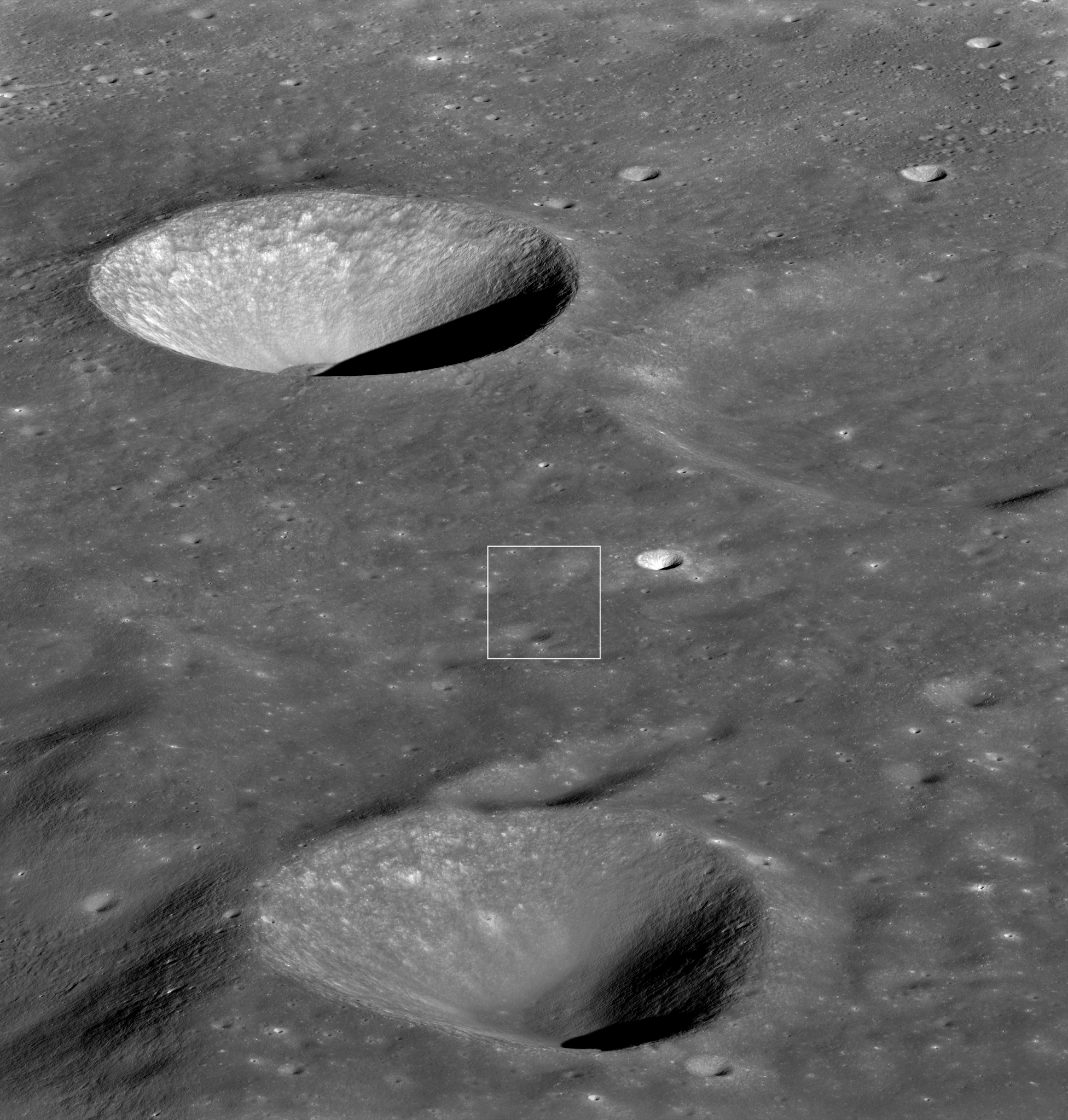 grayscale view of the lunar surface with several craters; a white box indicates the area of the image where LRO saw Danuri spacecraft