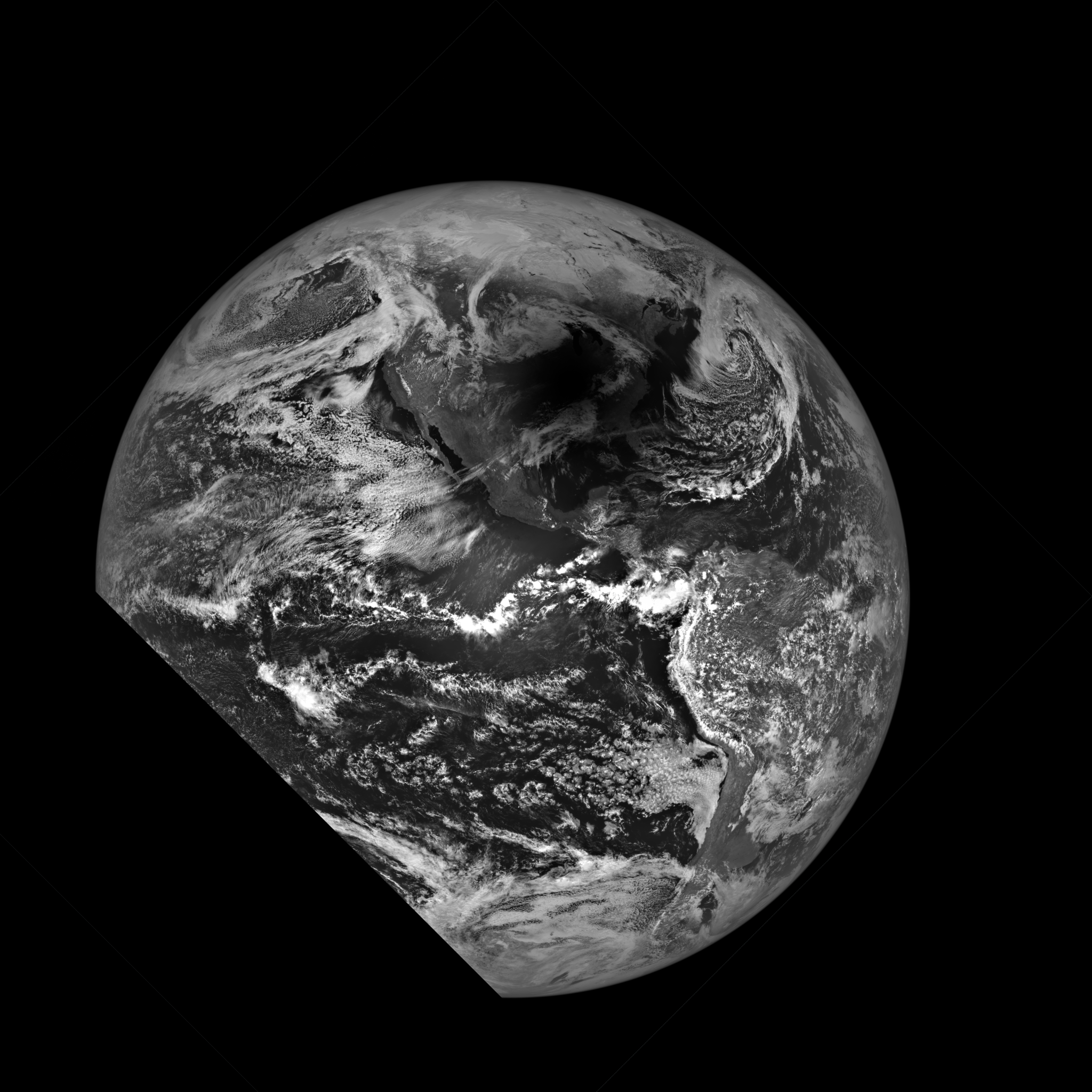 Black and white image of Earth with swirling white clouds and a dark shadow over North America from the Moon eclipsing the Sun.