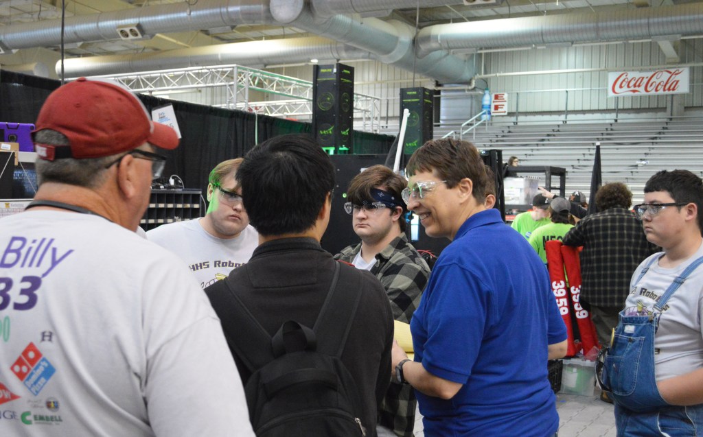 A judge, Michele Beisler, interacts with a team from Boutte, Louisiana