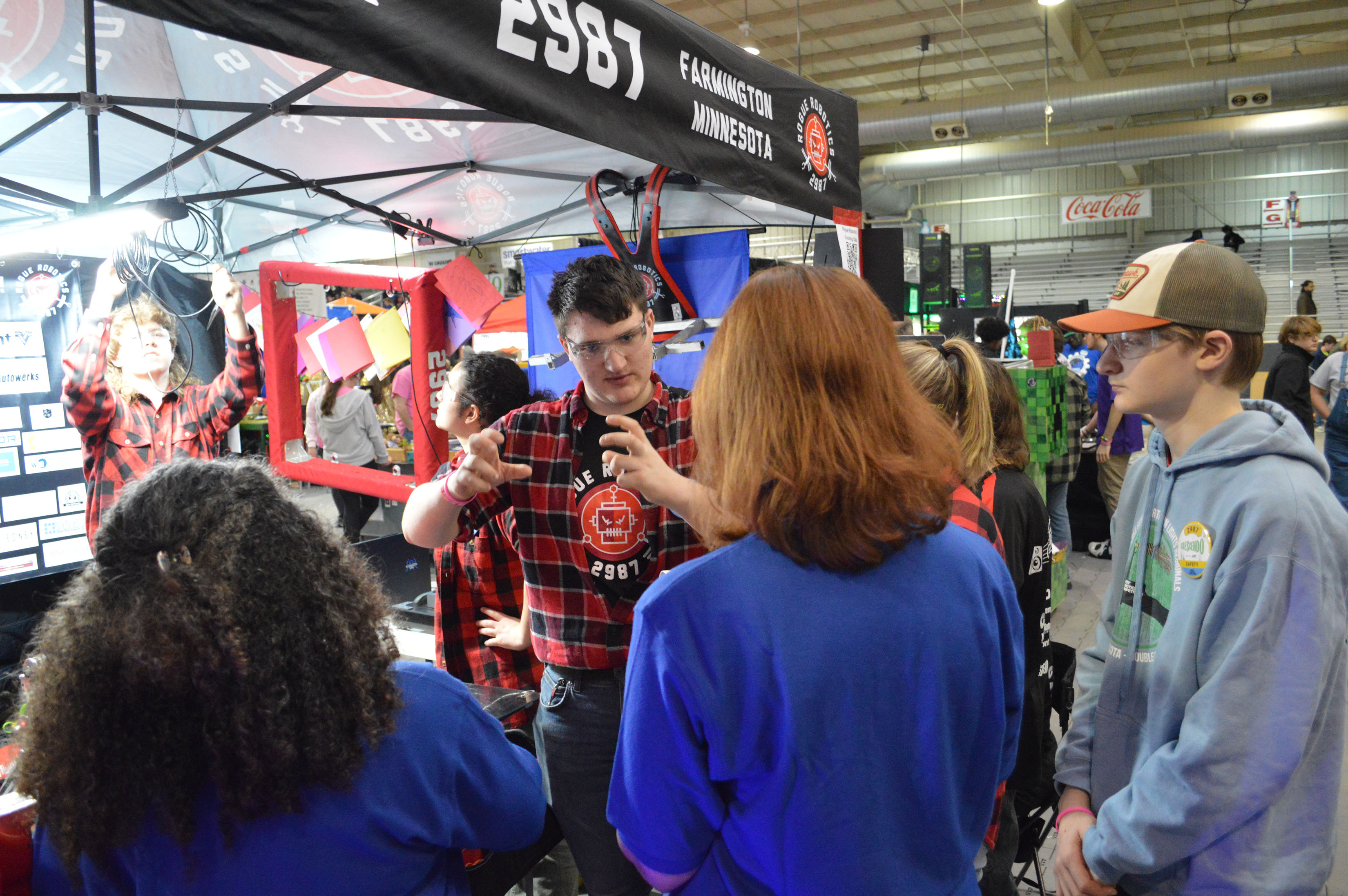 a robotics team is being interviewed by competition judges