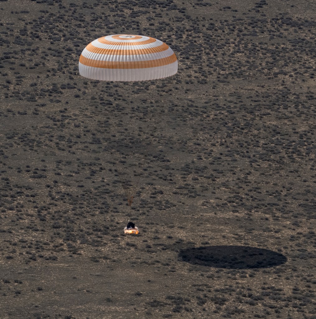 The Soyuz MS-24 spacecraft lands near the town of Zhezkazgan, Kazakhstan, under its main parachute on Saturday, April 6, 2024. The Soyuz crew ship fired its soft-landing engines a split second before landing to soften the impact of touching down on the Earth's surface. Aboard the Soyuz crew ship were NASA astronaut Loral O'Hara, Roscosmos cosmonaut Oleg Novitskiy, and Belarus spaceflight participant Marina Vasilevskaya who had undocked from the International Space Station several hours earlier. Credit NASA/Bill Ingalls