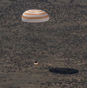 The Soyuz MS-24 spacecraft lands near the town of Zhezkazgan, Kazakhstan, under its main parachute on Saturday, April 6, 2024. The Soyuz crew ship fired its soft-landing engines a split second before landing to soften the impact of touching down on the Earth's surface. Aboard the Soyuz crew ship were NASA astronaut Loral O'Hara, Roscosmos cosmonaut Oleg Novitskiy, and Belarus spaceflight participant Marina Vasilevskaya who had undocked from the International Space Station several hours earlier. Credit NASA/Bill Ingalls