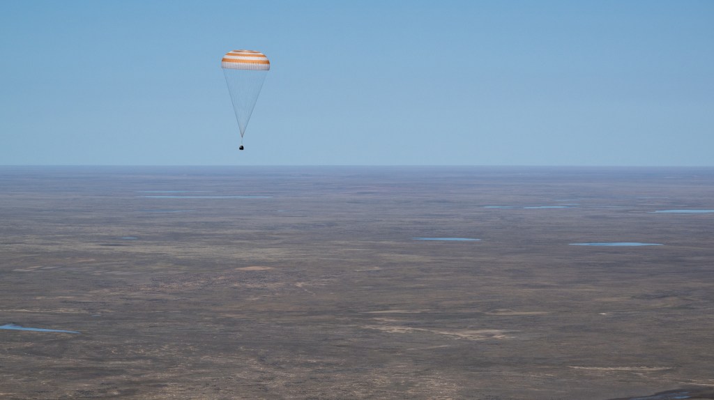 The Soyuz MS-24 spacecraft descends to Earth under its main parachute near the town of Zhezkazgan, Kazakhstan, on Saturday, April 6, 2024. Aboard the Soyuz crew ship were NASA astronaut Loral O'Hara, Roscosmos cosmonaut Oleg Novitskiy, and Belarus spaceflight participant Marina Vasilevskaya who had undocked from the International Space Station several hours earlier. Credit NASA/Bill Ingalls