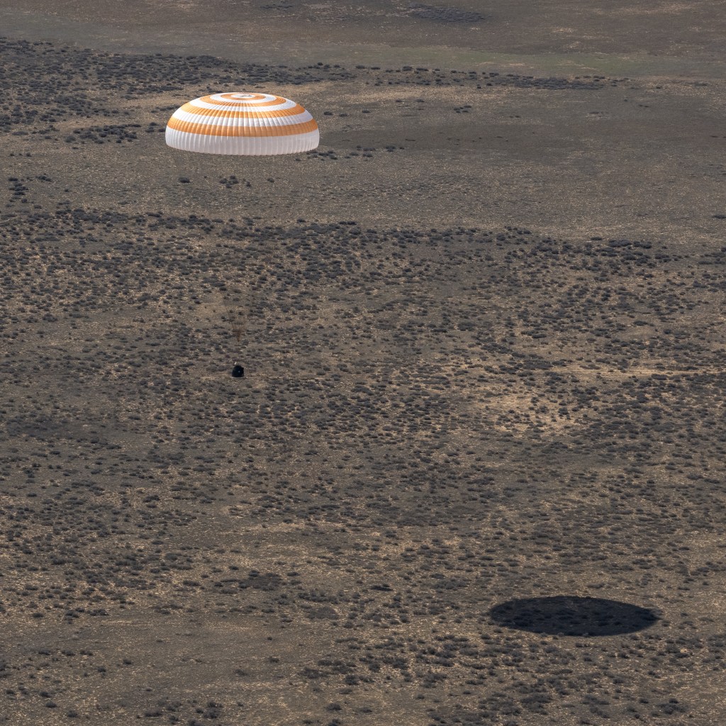 The Soyuz MS-24 spacecraft descends to Earth under its main parachute near the town of Zhezkazgan, Kazakhstan, on Saturday, April 6, 2024. Aboard the Soyuz crew ship were NASA astronaut Loral O'Hara, Roscosmos cosmonaut Oleg Novitskiy, and Belarus spaceflight participant Marina Vasilevskaya who had undocked from the International Space Station several hours earlier. Credit NASA/Bill Ingalls