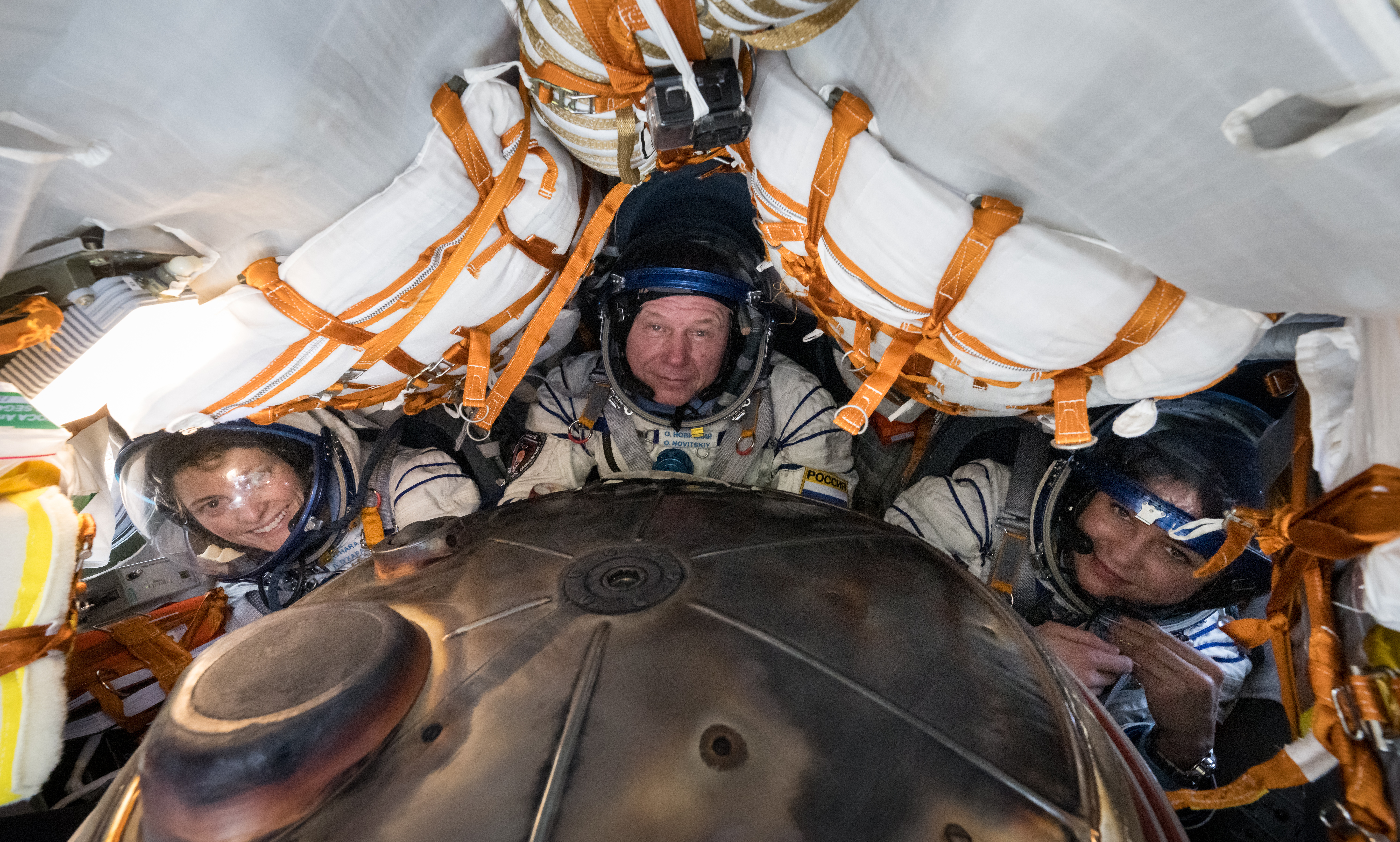 Crew members (from left) Loral O'Hara from NASA, Oleg Novitskiy from Roscosmos, and Belarus spaceflight participant Marina Vasilevskaya are pictured inside the Soyuz MS-24 spacecraft shortly after they landed in a remote area near the town of Zhezkazgan, Kazakhstan, Saturday, April 6, 2024. The trio had undocked from the International Space Station several hours earlier. Credit NASA/Bill Ingalls
