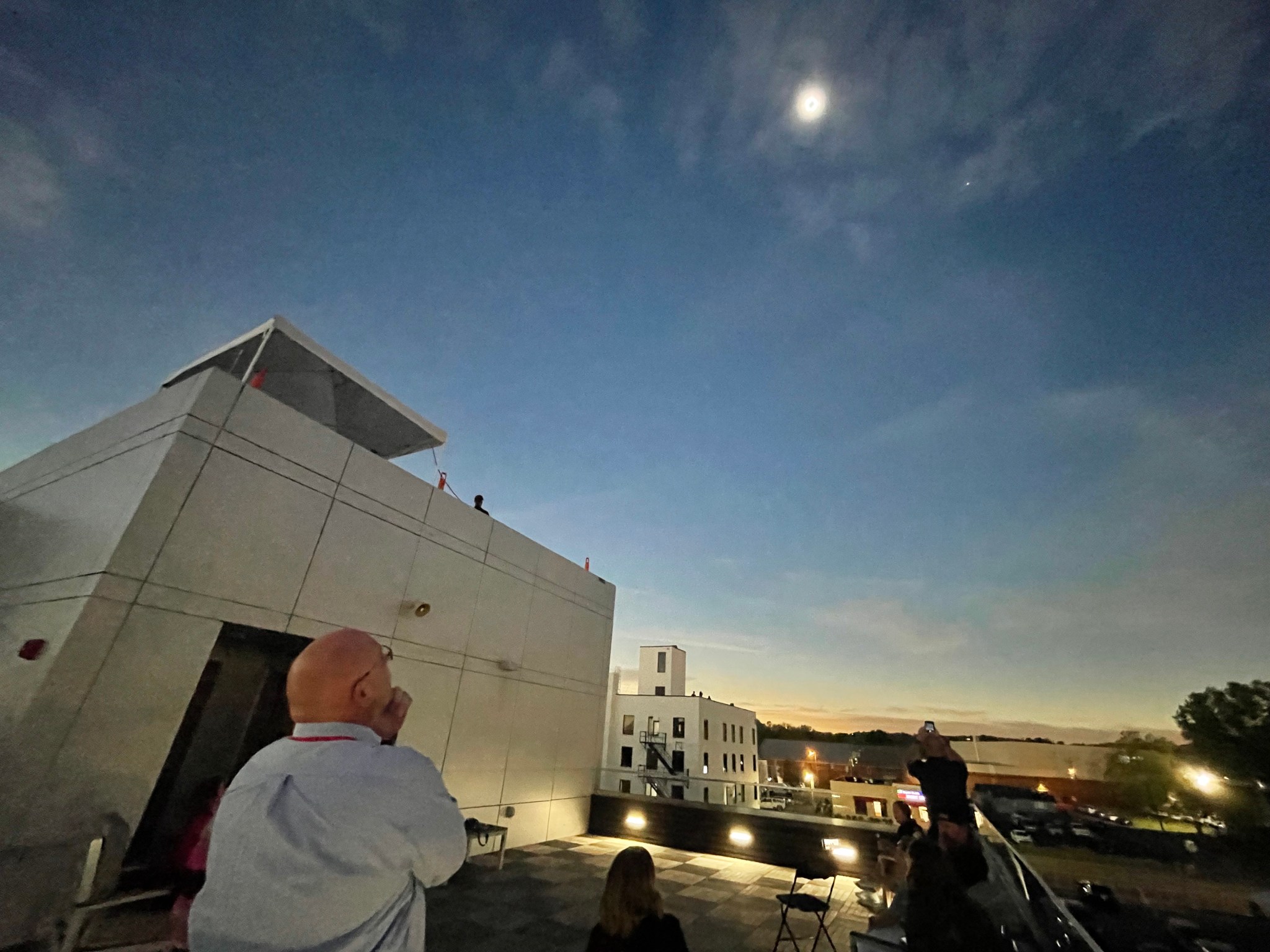 Marshall Space Flight Center Director Joseph Pelfrey watches the 2024 total solar eclipse from the mezzanine of the Russellville Central Fire Station in downtown Russellville, Arkansas, on April 8. Pelfrey spoke during a press conference the morning of the eclipse, alongside Stennis Space Center Acting Director John Bailey, retired astronaut Mike Massimino, NASA scientists, and Russellville and Pope County community leaders. Pelfrey shared updates on the data that NASA’s Heliophysics Division, based at Marshall, planned to collect from the eclipse to improve life here on Earth.
