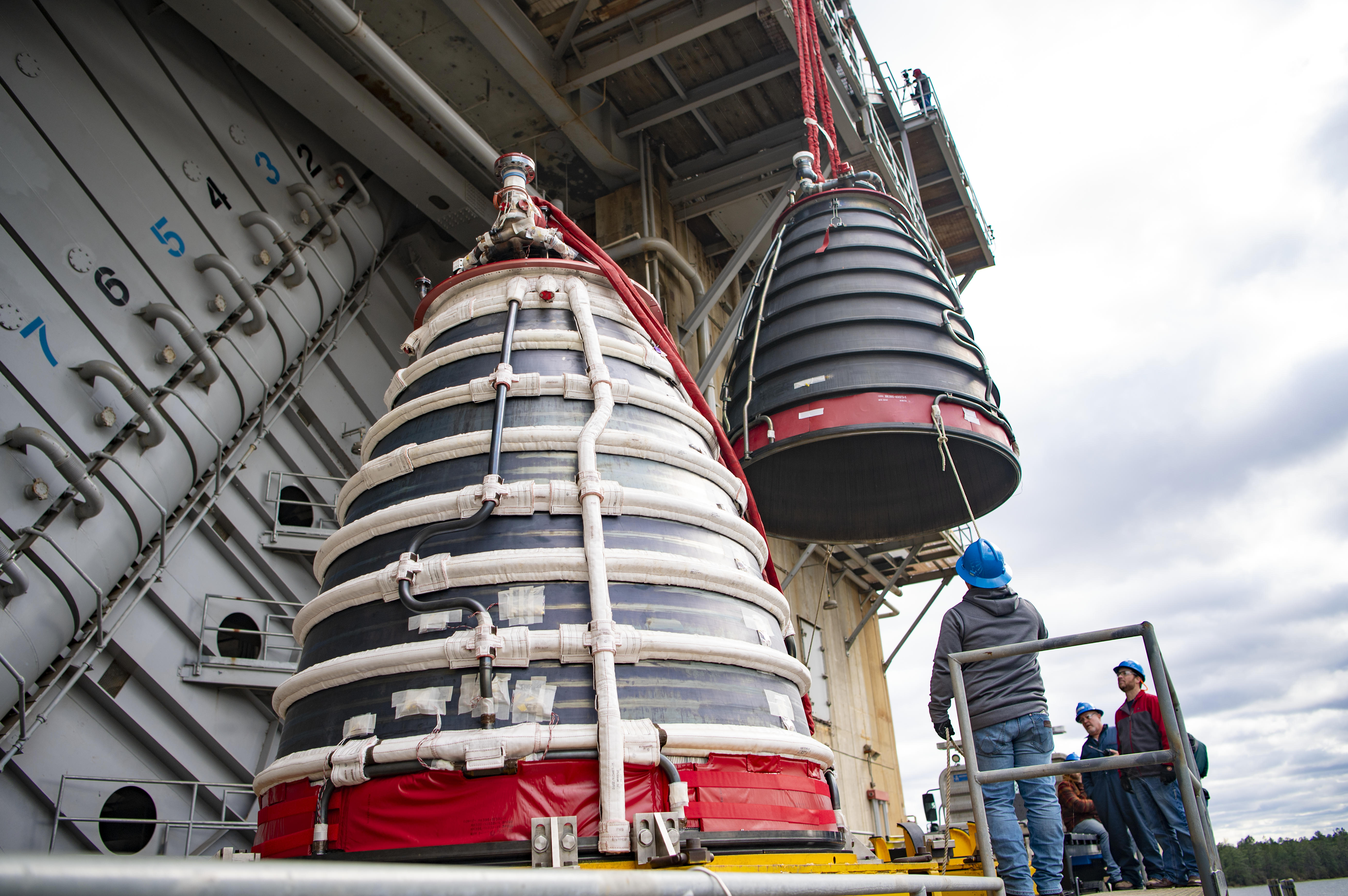 Teams at NASA's Stennis Space Center install a second production nozzle
