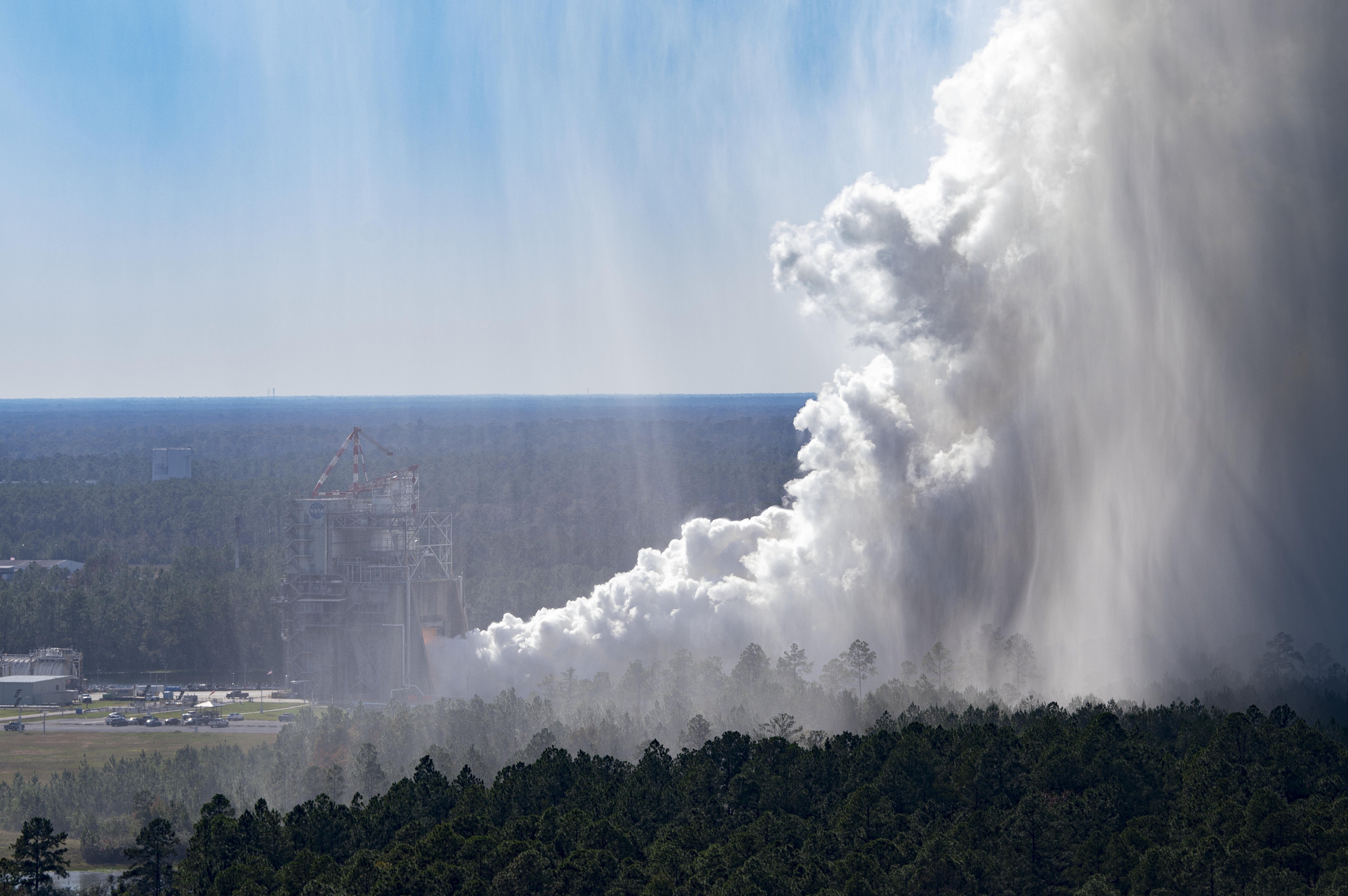 A cloud of steam is visible at NASA’s Stennis Space Center during a hot fire test
